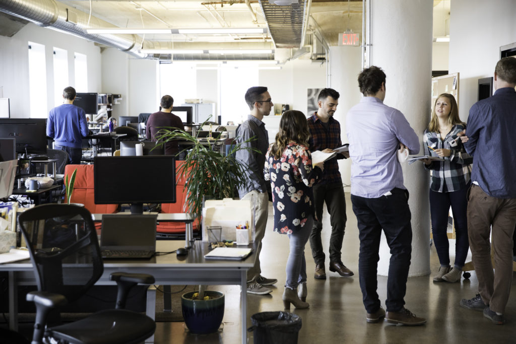 team members discussing daily tasks