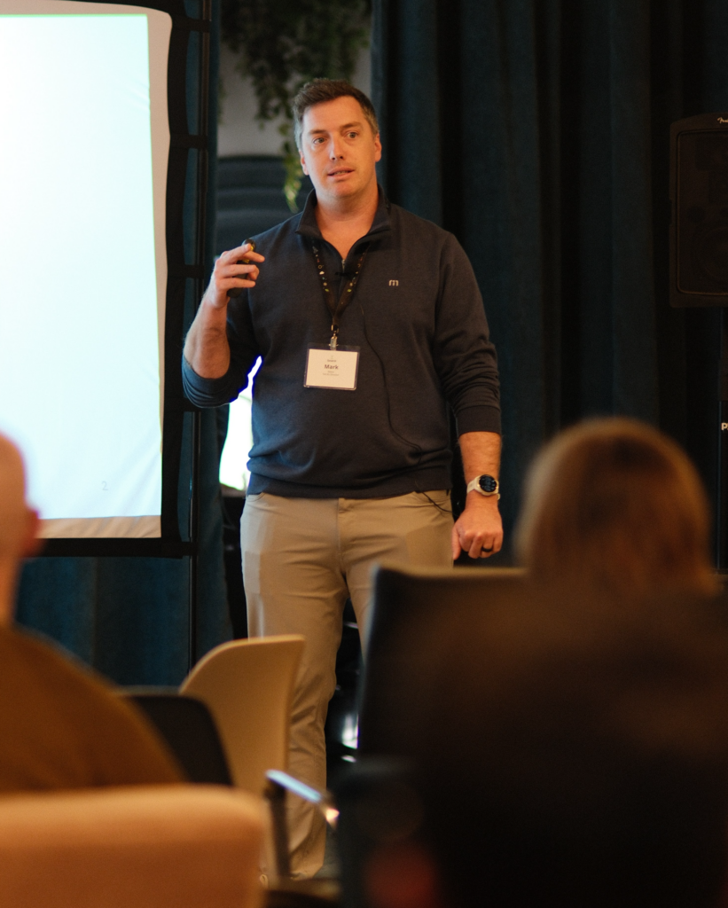 Mark Reese, Federal Unit Director, addresses the Element 84 team at a company on-site meeting.